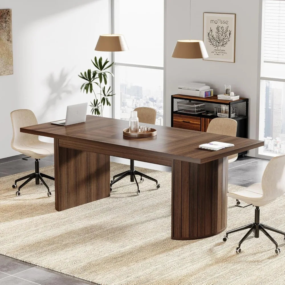 Modern office setup with a large wooden desk, conference table, meeting table